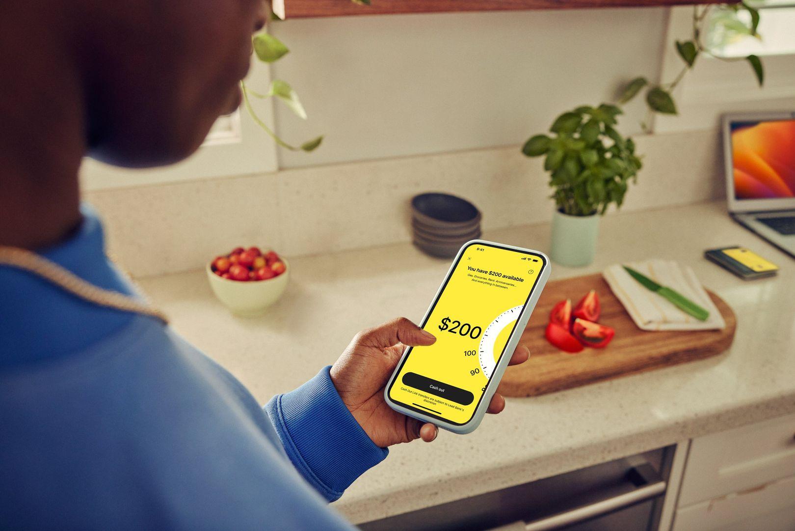 Woman cashing out on mobile app