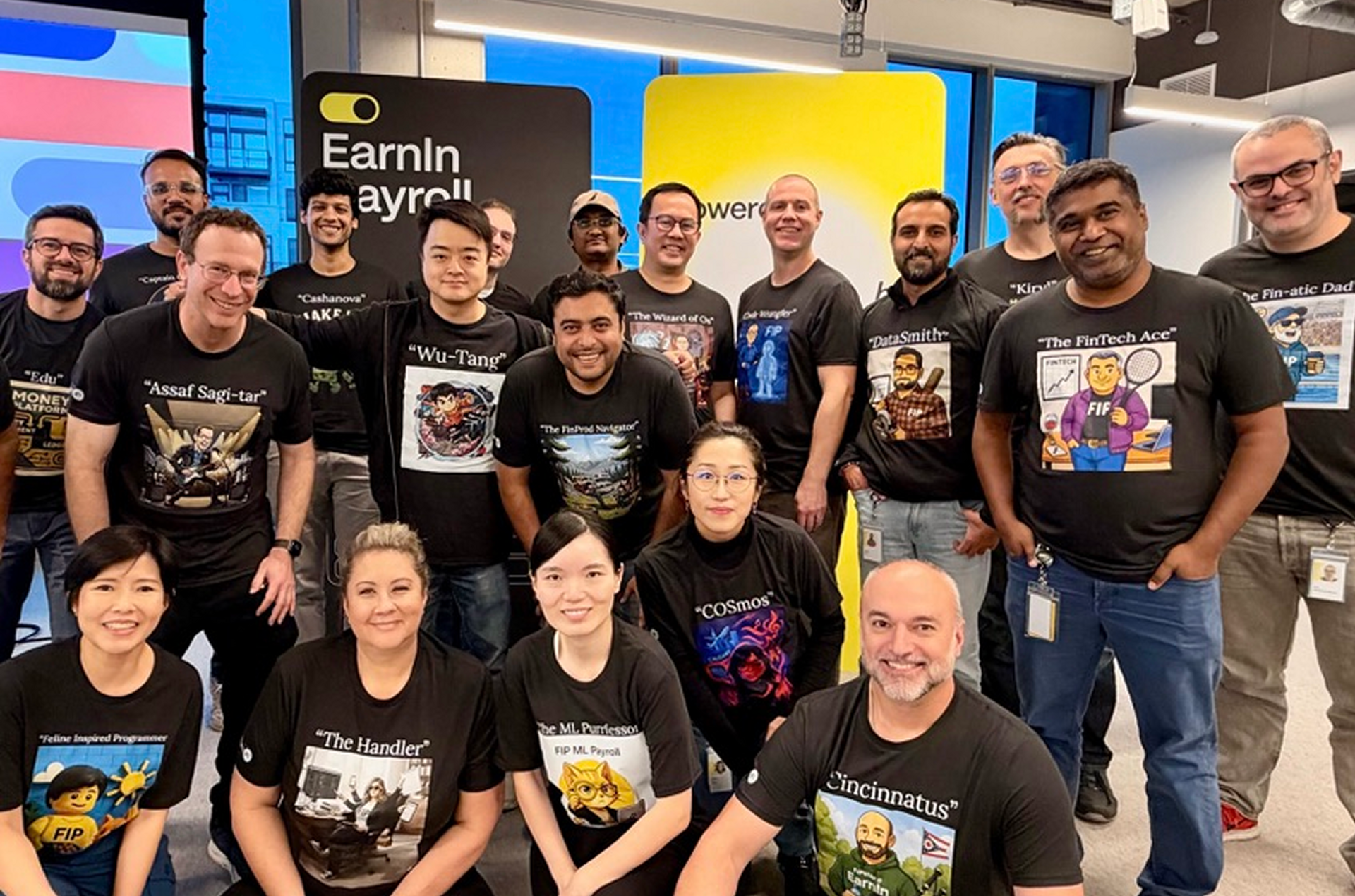 EarnIn teammates in matching shirts gathered for a group photo